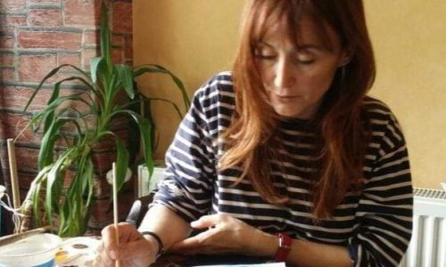 Camelia Gules Painting a boat